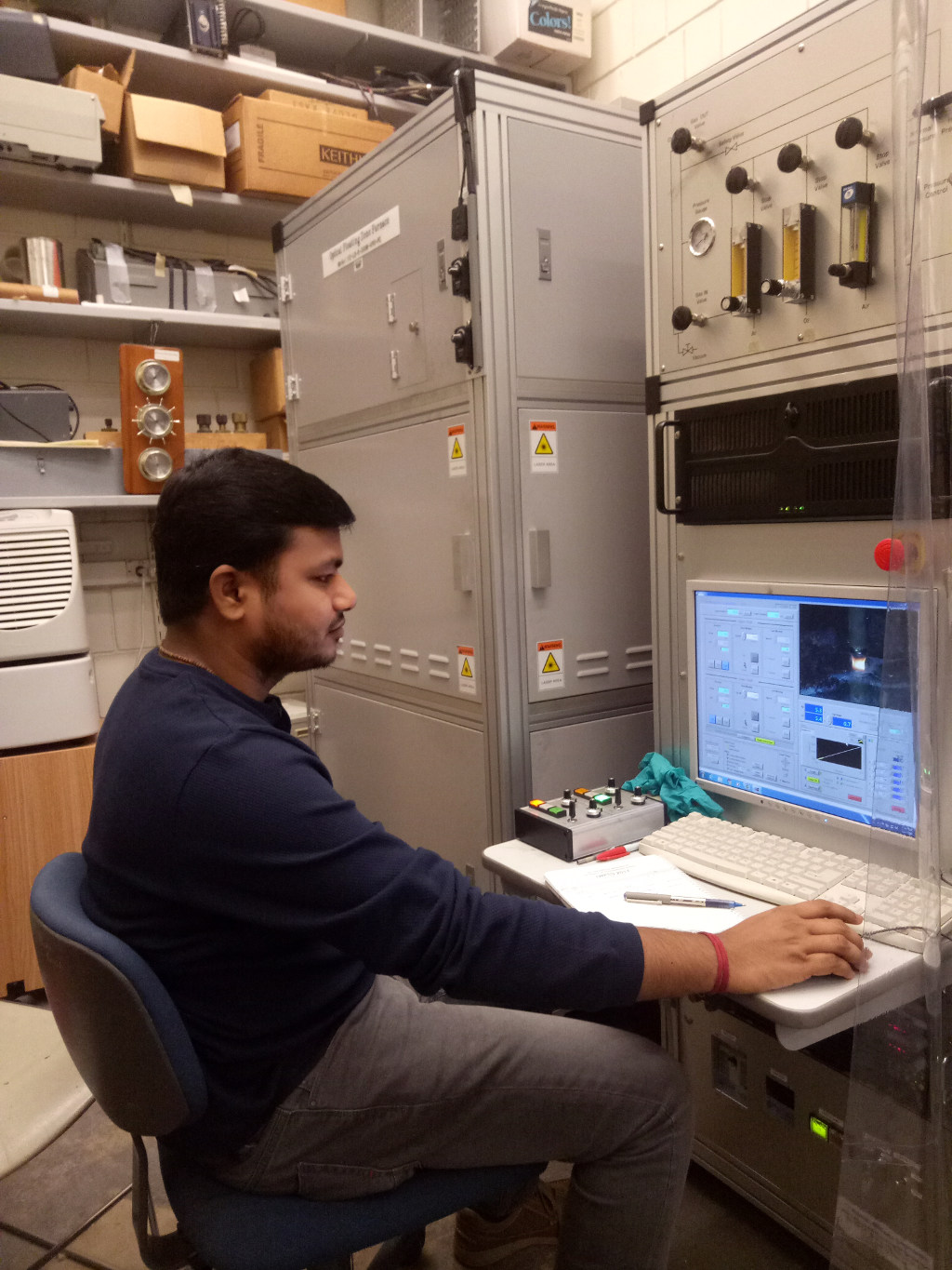 photo of Durga Sankar Vavilapalli  operating a four-mirror optical floating zone furnace