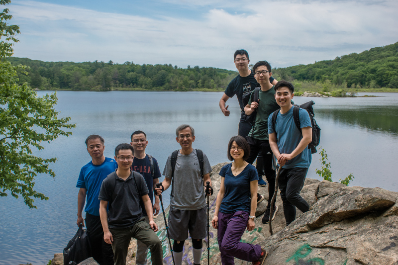 photo of cqms people on a rock on a mountain during group hiking trip in June to Harriman Park in 2018